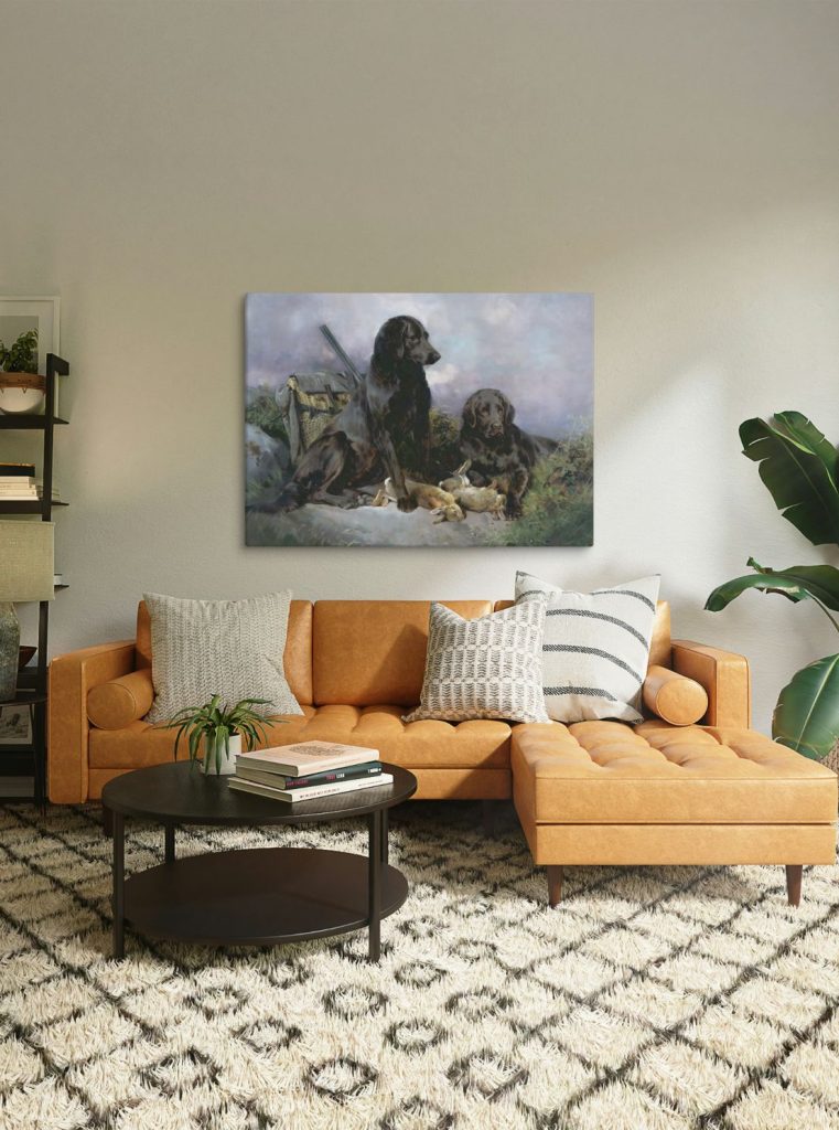Black lab hunting painting displayed in a living room over a nice leather sofa